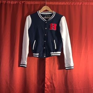 Ambiance navy blue varsity jacket with red accent.